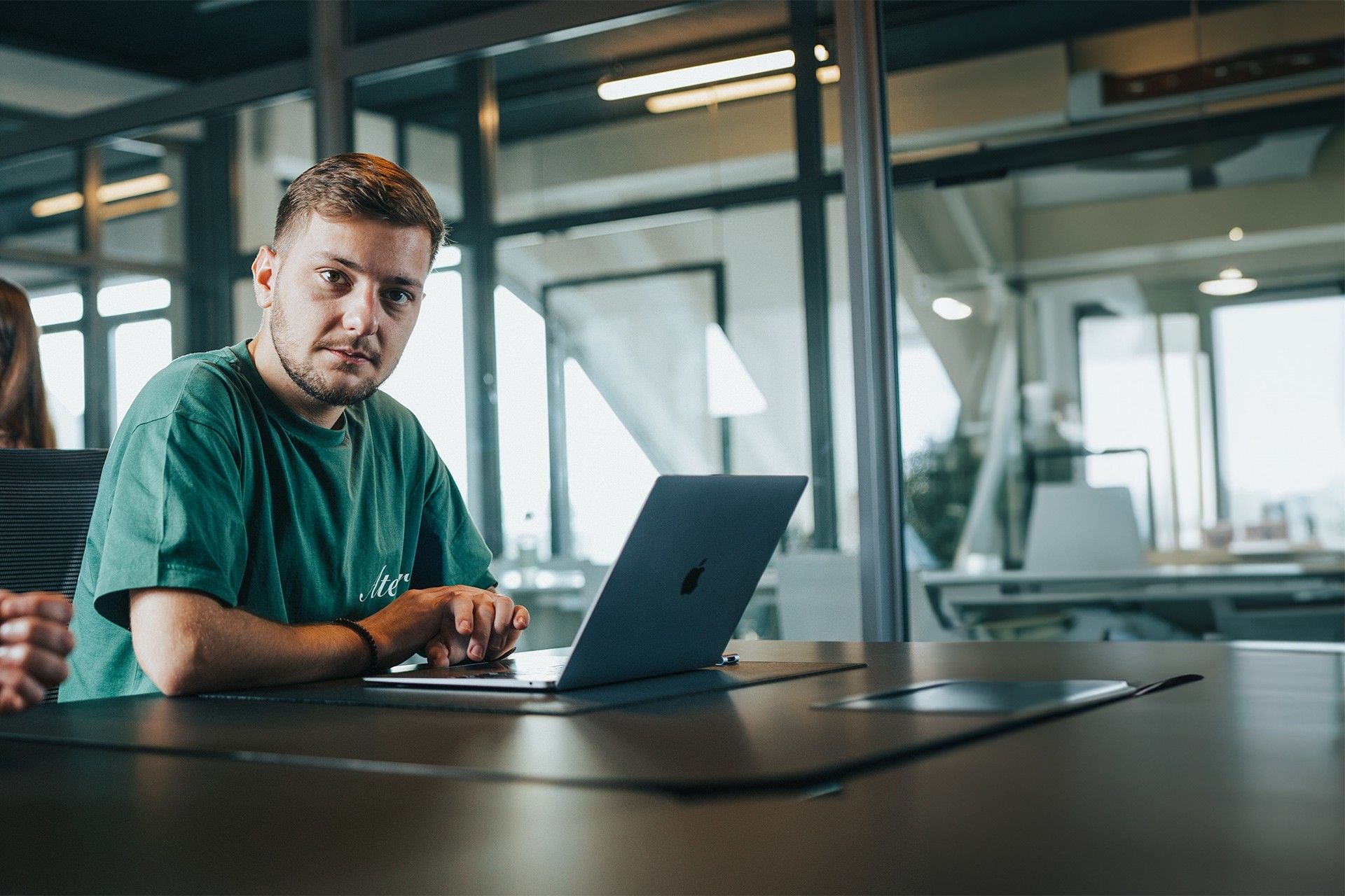 Sebek at a desk with a laptop
